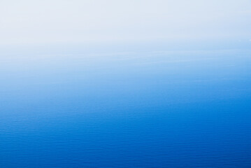 Blue sea water surface texture for background with colour gradient. Abstract nature image.