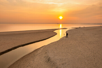 Beach of the Baltic Sea in Gdansk at sunrise. Poland - obrazy, fototapety, plakaty