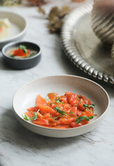 Traditional smoked salmon with greens