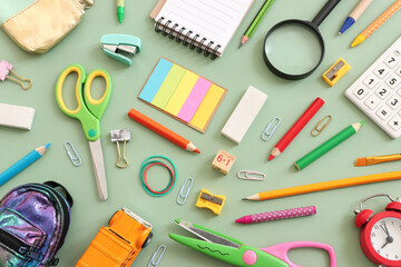 Back to school concept on pastel green background. Top view