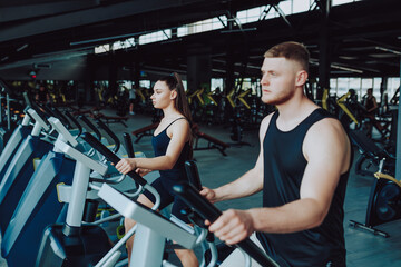 Fototapeta premium Caucasian male and Hispanic female athletes engaging in a competitive sports activity. Caucasian Man and Hispanic Woman Demonstrating Athletic Prowess