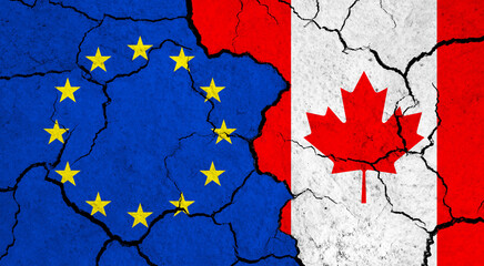 Flags of European Union and Canada on cracked surface - politics, relationship concept