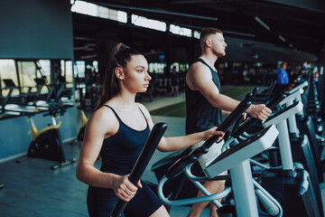 Hispanic man and Caucasian woman fitness. Fit Man and Woman Engaging in Cardio Workout Routine. Energetic Hispanic and American Pair Exercising for Health