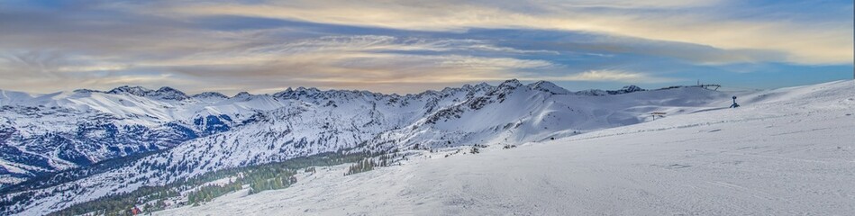 Panoramic image of a ski slope in Ifen ski resort in Kleinwalsertal valley in Austria