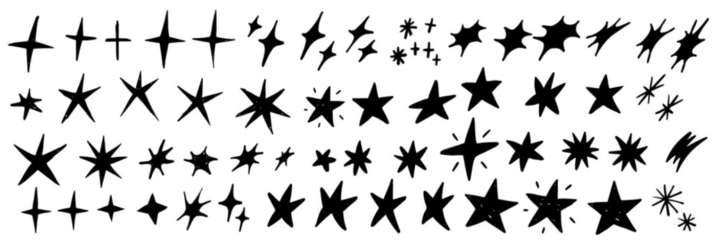 Set of hand drawn vector stars and sparkles, doodle style