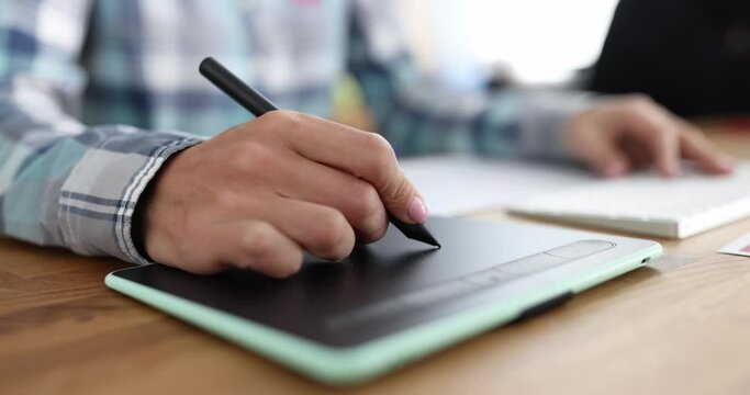 Woman sitting at computer and working with graphics tablet 4k movie. Design project of apartments concept