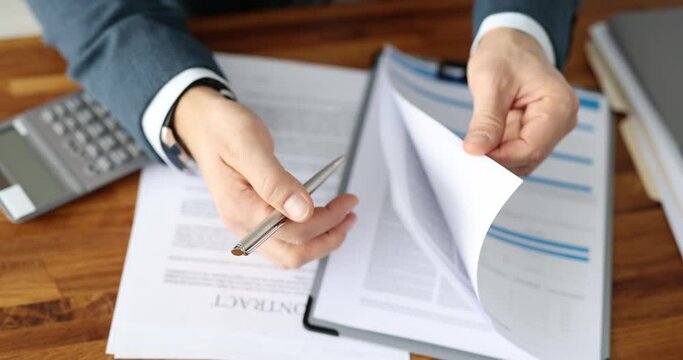 Insurance agent is leafing through medical insurance contract. Study of the contract before signing the concept