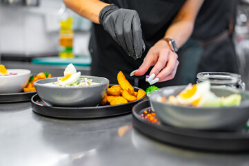 woman chef hand cooking soup on kitchen