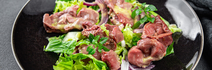 chicken stomach salad green lettuce, onion, salad dressing vegetable food healthy meal food snack on the table copy space food background rustic top view keto or paleo diet