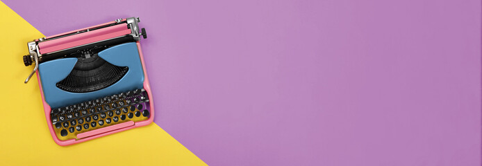 Copywriter. Vintage typewriter on color background, top view. Banner design with space for text