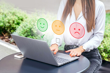 woman use laptop choosing green happy smile face icon. mental health concept. world mental health...
