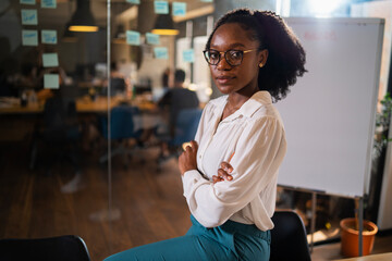 Happy businesswoman in office. Portrait of beautiful businesswoman.