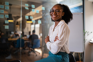 Fototapeta premium Happy businesswoman in office. Portrait of beautiful businesswoman.