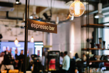 Espresso bar signs at the coffee shop. Professional coffee brewing by the barista.