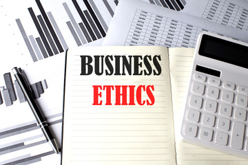 BUSINESS ETHICS text written on a notebook on chart and diagram