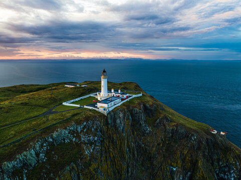 Sunset over Mull of Galloway Lighthouse from a drone, Mainland Scotland, UK