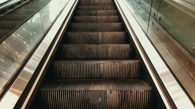 empty escalator stairs point of view