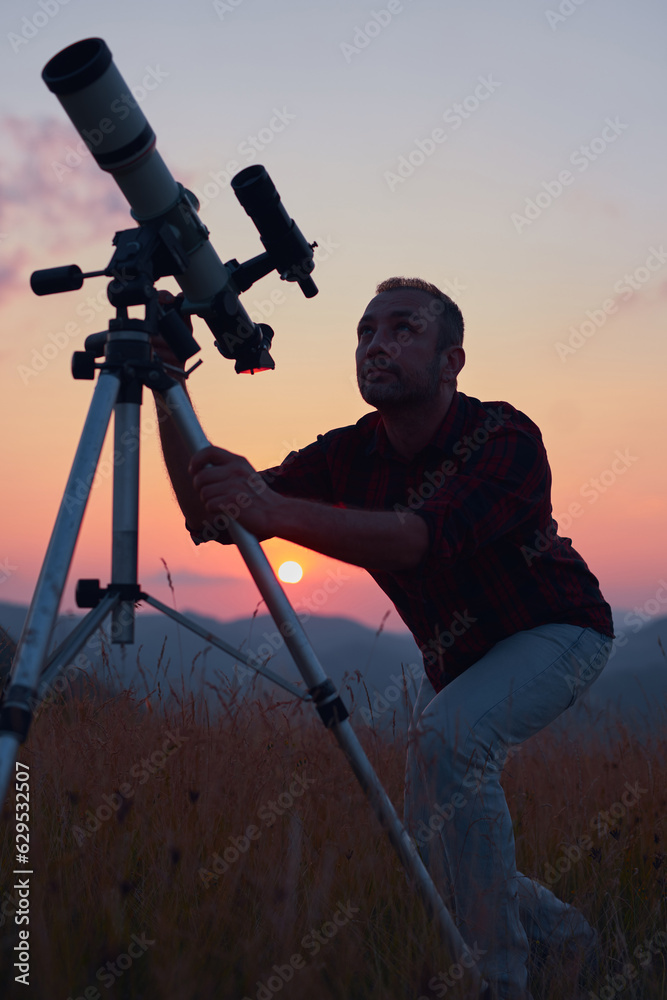 Canvas Prints astronomer looking at the skies with a telescope.