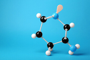 Structure of molecule on light blue background, space for text. Chemical model