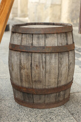 Obraz premium Traditional wooden barrel on street outdoors. Wine making