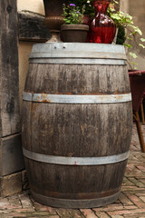 Traditional wooden barrel and beautiful houseplants outdoors