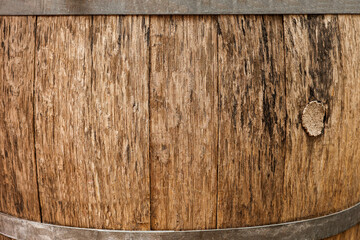 Fototapeta premium Traditional wooden barrel as background, closeup. Wine making