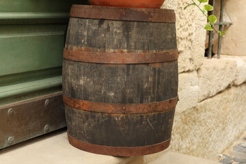 Traditional wooden barrel on street outdoors. Wine making