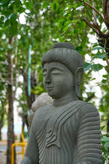 rock buddha statue in garden wat