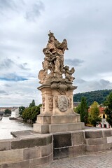 Fototapeta na wymiar The statue of Saint Ludmila by Matthias Braun (circa 1710s), installed on the south side of the Charles Bridge in Prague