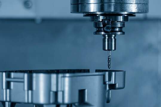 The CNC milling machine thread making the automotive parts by tapping tools.