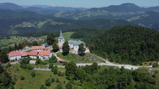A drone view of an old church located on a hill. The camera moves smoothly to the left. Zasavje Holy Mountain, The Mary&rsquo;s Nativity Church.