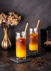 Food photography of Coffee; bumblebee; orange; juice; iced; drink; beverage; refreshment; sugar; straw; cool; freshness;