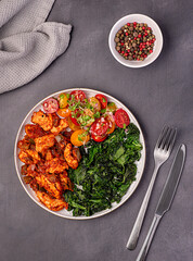 Food photography of fried kale, leaf, cabbage, chicken; stew; casserole; savoury food; curry; tomato; salad, sauce; homemade