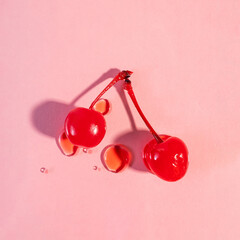 Maraschino sweet cherries isolated on pink background - obrazy, fototapety, plakaty