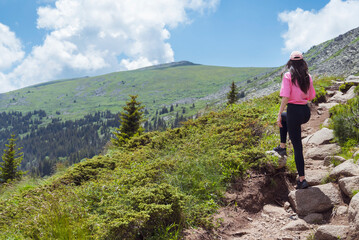 Fototapeta premium Fit Woman in the beautiful green summer mountain . Vitosha mountain ,Bulgaria