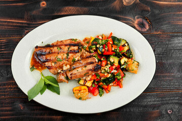 Tuna steak with grilled vegetables.