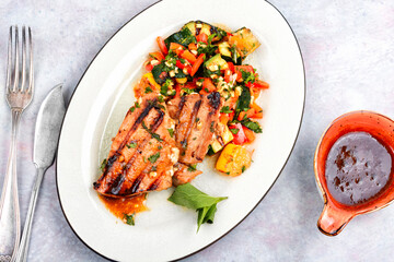 Tuna steak fried with grilled vegetables.