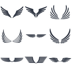 Fototapeta na wymiar Set of retro inked modern wings icons and emblems for logos, coat of arms signs or other graphic or printing materials.