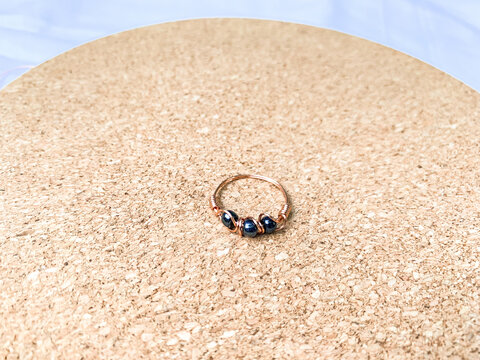 Handmade wire copper ring with metallic beads. Wire wrapped accessories.