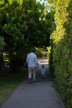 father and son walking footpath