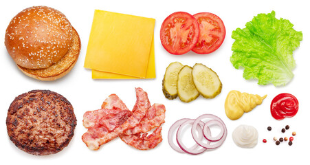 Set of cheeseburger ingredients such as bun, bacon, cheese, vegetables, sauces and meat patty on white background.