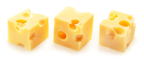 Three Emmental or Maasdam cheese cubes isolated on white background.