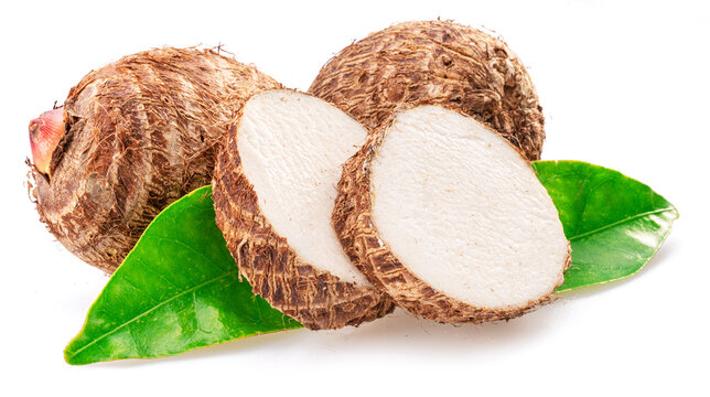 Raw organic eddoe or taro corms with cross cuts isolated on white background.