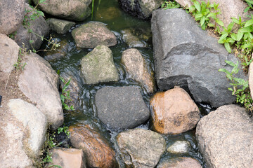 stones lying in river water