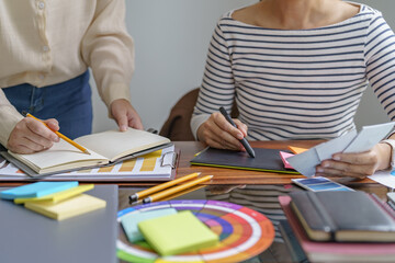 Teamwork brainstorming Creative idea Business project. Business People meeting taking notes while discussing with Color swatch samples to share idea