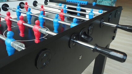 Football table or soccer table game with plastic player figurine. Mini Soccer game which famous in...
