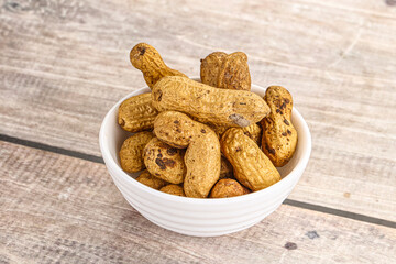 Raw ripe unpeeled peanut heap