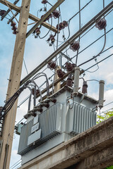 High voltage electrical insulation in a power substation Shoot from a view below close up. Transformer power poles is used to make electricity available to homes.