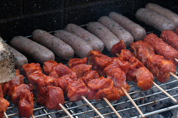 Barbecue on brick permanent hearth in urban house garden.