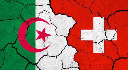 Flags of Algeria and Switzerland on cracked surface - politics, relationship concept